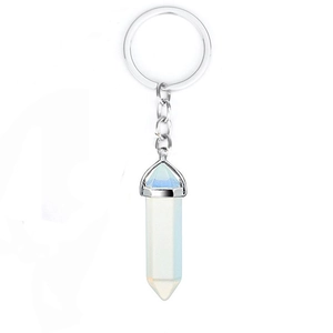 Detail view of light blue hexagonal crystal pendant keychain with silver metal ring