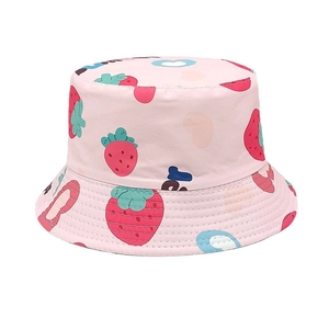 Close-up of pink bucket hat with cute strawberry and heart patterns and reinforced brim