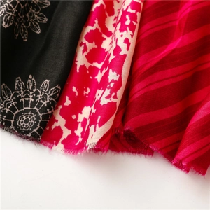 Close-up of floral, spotted, and striped patterns on soft cotton-linen blend fabric