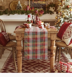 Close-up detail of classic red and green tartan plaid table runner for Christmas decor