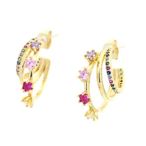 Gold multi-layer C-shaped hoop earrings with colorful inlaid rhinestones on white background