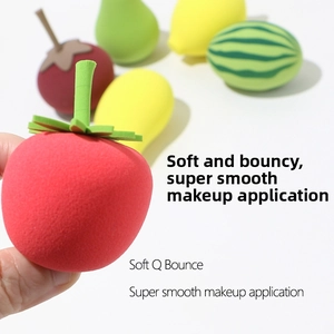 Close-up of assorted fruit-shaped makeup sponges showing soft matte texture