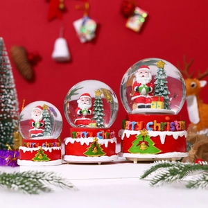 Three sizes of Christmas snow globes with Santa Claus and festive base detail