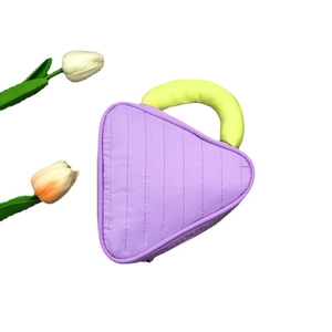 Purple quilted triangle makeup bag with thick yellow handle on a white background