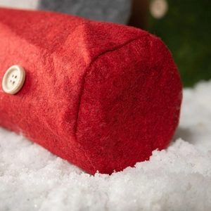 Christmas gnome wine bottle cover with red felt texture and white wooden button decoration