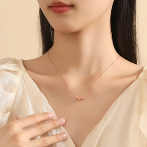 Minimalist S925 sterling silver necklace featuring three gold spherical bead pendants