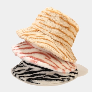Thick plush bucket hats in faux fur with zebra and tiger patterns for winter warmth