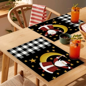 Detail of Nordic Christmas placemats with Santa Claus pattern on a wooden dining table