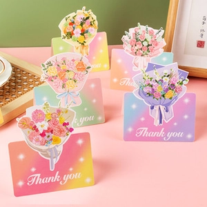 Macro detail of colorful floral thank you greeting cards with 3D paper flower bouquets
