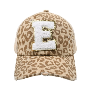 Detail of leopard print ponytail baseball cap with chenille letter E patch and mesh back