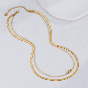 Double-layered gold stainless steel necklace with flat snake chain and infinity pendant