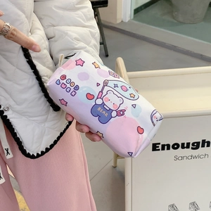 Cartoon bear print canvas pencil case and organizer pouch held in hand for daily use