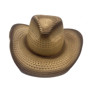 Macro detail of breathable woven texture and brown gradient brim on straw cowboy hat