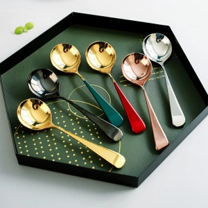 Artistic layout of 304 stainless steel spoons in various finishes on a hexagonal tray