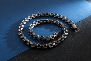 Macro shot of industrial hexagonal link chain with vintage silver finish and texture