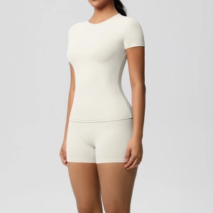 Detail of high-elasticity cream yoga set showing tight fit and brushed texture material