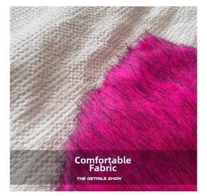 Close-up of fluffy pink faux fur fabric showing soft texture and high-density long fibers