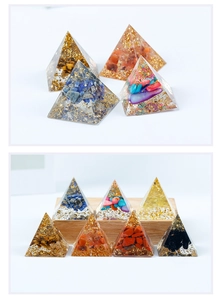 Macro shot of resin orgone pyramids with natural crystal chips and gold foil details