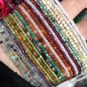 Detailed view of 2-3mm faceted square natural gemstone beads in assorted colors for DIY jewelry