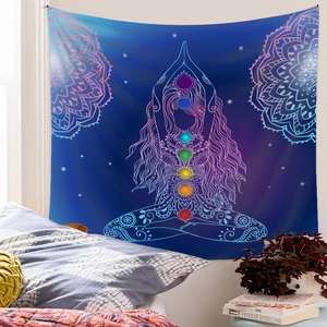 Detail of meditation tapestry with seven chakra colors and mandala pattern on blue background