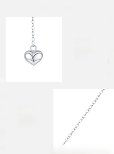 Detail of 925 sterling silver heart pendant with high-quality mirror polished finish