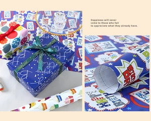 Detail of happy birthday gift wrapping paper with balloon patterns and gold ribbons
