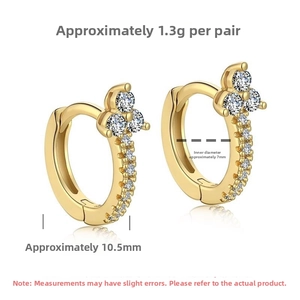 Detail view of gold clover earrings with cubic zirconia and 10.5mm height dimensions