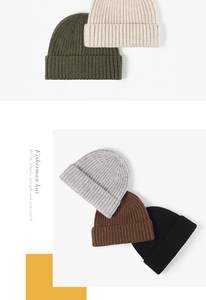 Detail of ribbed knit fisherman hats in beige, olive, grey, brown, and black colors