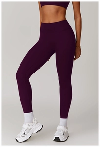 Detail of high-waist quick-dry compression yoga leggings in deep purple matte finish