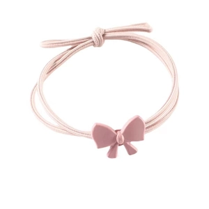 Detail of pink bow hair tie featuring multi-strand high elasticity rubber bands