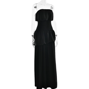 Detail of elegant black strapless maxi dress with ruffle accents on a mannequin