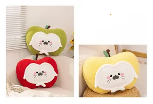 Detailed view of apple-shaped plush pillows in red, yellow, and green with cat embroidery