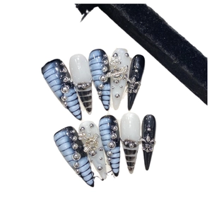 Handmade press-on nails with blue dream aurora gradient, crocodile pattern, and Saturn charms