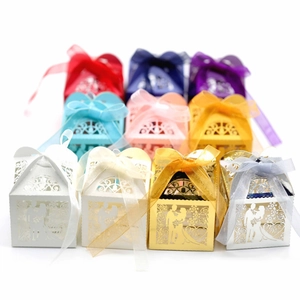 Laser cut hollow wedding candy boxes with Mr & Mrs design and elegant ribbon bows