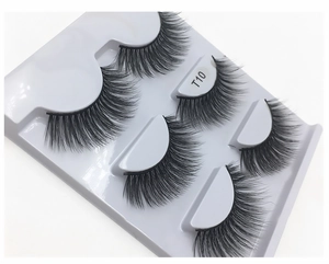 Close-up of T10 thick cross-pattern faux mink eyelashes set in a white tray