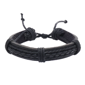 Detail of multi-layer black braided leather bracelet with adjustable cord knots