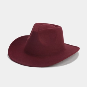 Close-up of a burgundy wool felt fedora hat featuring a wide brim and detailed stitching
