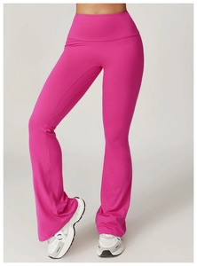 Detail of high-waisted rose red flared yoga pants showing fabric texture and supportive fit