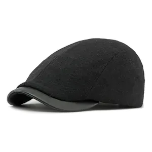 Retro black wool blend newsboy cap with a stylish faux leather brim for men and women