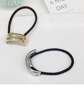 Detail of U-shape gold and silver alloy hair rings with high elastic black ponytail bands