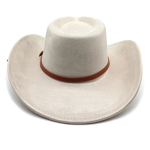 Detail of beige suede cowboy hat with brown leather band and metal buckle accessory