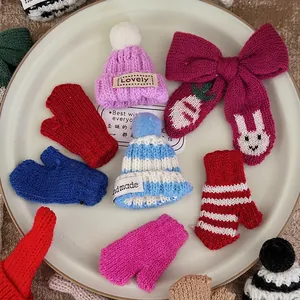 Miniature knit Christmas hats and mittens in assorted colors for DIY holiday crafts