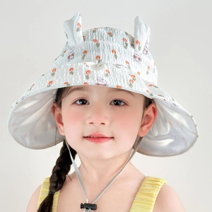 Close-up of kids sun hat featuring cute rabbit ears and orange floral patterns