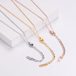 Close-up of three-tone 18KGP necklaces in gold, silver and rose gold with lobster clasp
