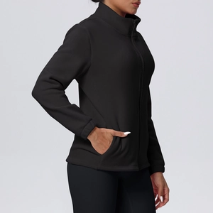 Detail view of the black fleece sports jacket with stand-up collar and side pockets