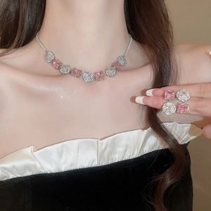 Silver jewelry set with pink square zircon necklace and earrings on model