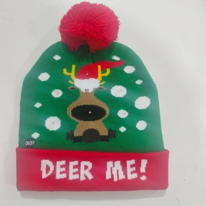 Detail of Christmas knitted hat with LED lights featuring reindeer patterns and DEER ME text