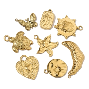 Collection of gold vacuum plated stainless steel pendants with heart, palm and butterfly motifs
