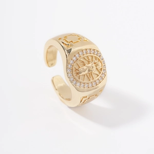 Gold plated open signet ring featuring a religious Virgin Mary relief with small crystals
