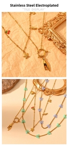 Detail of 18K gold plated stainless steel necklaces featuring starfish and butterfly charms